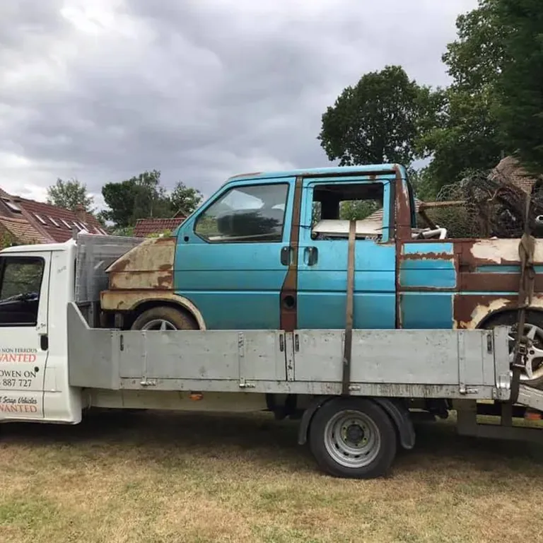 rusty light blue van